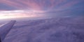 Breathtaking view outside of a plane flying just above the cloud line