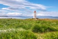 Breathtaking view of Skarsviti lighthouse in Vatnsnes peninsula on a clear day in North Iceland