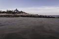 Breathtaking view of a small wooden sea shelter with stairs on the beach on a calm, sunny day Royalty Free Stock Photo