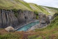 Breathtaking view of Studlagil canyon in Jokuldalur Valley in Iceland. Basalt columns and turquoise glacier river