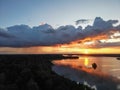 Breathtaking view of a stunning golden horizon as the sun sets over a tranquil lake