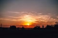 Breathtaking view of the sunset in the beautiful sky over a field captured in Wlodawa, Poland Royalty Free Stock Photo