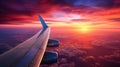 A breathtaking view of the sunset setting over the wing of an passenger plane