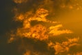 Breathtaking view of a vibrant orange sunset sky, illuminated by plush, white clouds Royalty Free Stock Photo