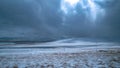 Breathtaking view of white clouds gathered above empty plains and snowy Himalaya