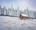 Breathtaking winter scene of abandoned mountain village with old wooden chalet.