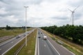 Brecht, Antwerp Province, Belgium - The A1 highway with wind mill turbines in the background Royalty Free Stock Photo