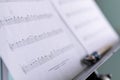 Brecht, Belgium - April 15 2020: A close up portrait of a music sheet with notes on it on a music stand. There is also a pencil on Royalty Free Stock Photo