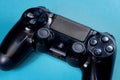 Brecht, Belgium - January 15 2020: A top down portrait of a playstation 4 console controller on a blue background