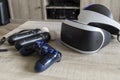 Brecht, Belgium - June 12 2019; A playstation 4 VR headset together with a playstation 4 controller and two move controllers on a Royalty Free Stock Photo