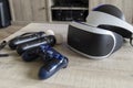 Brecht, Belgium - June 12 2019; A playstation 4 VR headset together with a playstation 4 controller and two move controllers on a