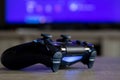 BRECHT, BELGIUM Ã¢â¬â MARCH 28 2019: A close up portrait of a Sony Playstation 4 controller on a wooden table.