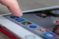 Brecht, Belgium - November 14 2019: A portrait of a finger of a user ready to open the Facebook app on his/her computer tablet