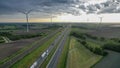 Brecht, Belgium, 16th of may, 2022, Motorway with cars and trucks in line in a traffic jam and the railroad next to it Royalty Free Stock Photo