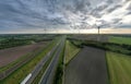 Brecht, Belgium, 16th of may, 2022, Motorway with cars and trucks in line in a traffic jam and the railroad next to it