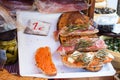 Bred with olive oil pa amb oli with jamon, sobrasada and Majorcan herbs for sale at Sineu market, Majorca