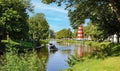 River mark with boats at city park Valkenberg, white-red striped lighthouse