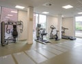 Various fitness and cardio equipment in a gym room