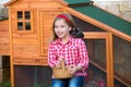 Breeder hens kid girl rancher farmer with chicks in chicken coop Royalty Free Stock Photo