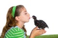 Breeder hens kid girl rancher farmer kissing a chicken chick Royalty Free Stock Photo