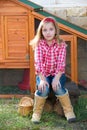 Breeder hens kid girl rancher farmer sitting in chicken tractor