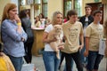 Breeder holds her Golden British Shorthair cat and is waiting for the competition results