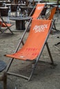 aperol Spritz logo on orange long chair at the restaurant terrace