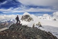 Breithorn Mounitan in Swiss alps. Tourist standing on Klein Matterhorn looking at Breithorn.