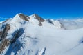 Breithorn traverse knife edge snow ridge glacier walk and climb in the Alps Royalty Free Stock Photo