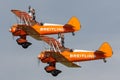 Breitling Wing walkers barnstorming flying display in vintage Boeing Stearman biplanes Royalty Free Stock Photo