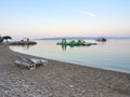 Brela, Croatia - July 24, 2021: Loznica beach with beach chairs in a seaside resort. A quiet morning on the Adriatic. Royalty Free Stock Photo