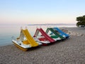 Brela, Croatia - July 24, 2021: Pedal boats on the beach in a seaside resort on the Adriatic Sea. Beautiful sea landscape
