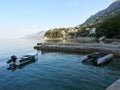 Brela, Croatia - July 24, 2021: Small marina with moored motorboats. Seaside landscape of the Adriatic Sea Royalty Free Stock Photo