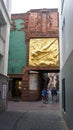 Bremen, Germany - 07/23/2015 - Der Lichtbringer Bringer of Light golden relief on Bottcherstrasse in old town Royalty Free Stock Photo