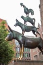 Bremen, Germany - 06/13/2019: famous sculpture of Bremen musicians. Bronze monument of fairytale animals. Grimm brothers heritage.