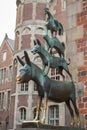 Bremen, Germany - 06/13/2019: famous sculpture of Bremen musicians. Bronze monument of fairytale animals. Grimm brothers heritage.