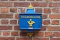 Bremen, Germany - July 10th, 2018 - Vintage German blue mailbox with golden lettering
