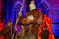 stilt walker with clay make up in front ot the Bremen cathedral