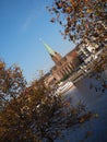 Bremen, Germany - River Weser with St. Martini church framed by trees in the foreground with slanted horizon Royalty Free Stock Photo