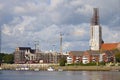 Bremen, Germany - September 14th, 2017 - Riverside construction site with cranes, partly and fully completed residential buildings