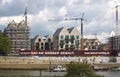 Bremen, Germany - September 14th, 2017 - Riverside construction site with cranes, partly and fully completed residential buildings