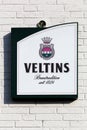 Veltins beer logo on a wall
