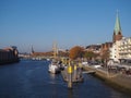 Bremen, Germany - View of the river Weser and the historic Schlachte waterfront with the spire of St. Martini church Royalty Free Stock Photo