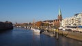 Bremen, Germany - View of the river Weser and the historic Schlachte waterfront with the spire of St. Martini church Royalty Free Stock Photo