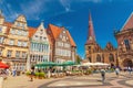 Bremen: View of the Central Square of Bremen with traditional Gothic architecture, cafe, restaurants and walking people