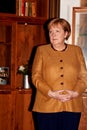 Portrait of the German Chancellor Angela Merkel with yellow jacket Royalty Free Stock Photo