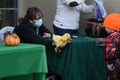 Woman showing a duck puppet to a kid during the Halloween celebration in Valentinetti Puppet Museum