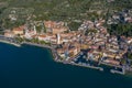 Aerial view of Castelletto di Brenzone at Garda Lake,  showing the coastline with roads and the tranquil coastal villages Royalty Free Stock Photo