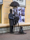 Brest, Belarus - 03.03.3024 - Funny sculpture of the photographer in the front of the photo studio. City