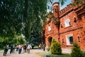 Brest, Belarus. People Tourists Walking Near Outside Outdoor Facade Of The Kholm Gate Gates Of The Brest Fortress